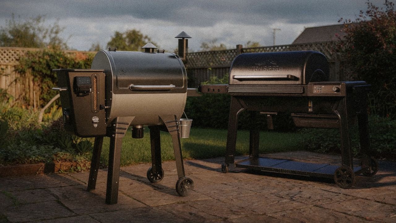Camp Chef Woodwind WiFi 24 beside Traeger Timberline, editorial product photography