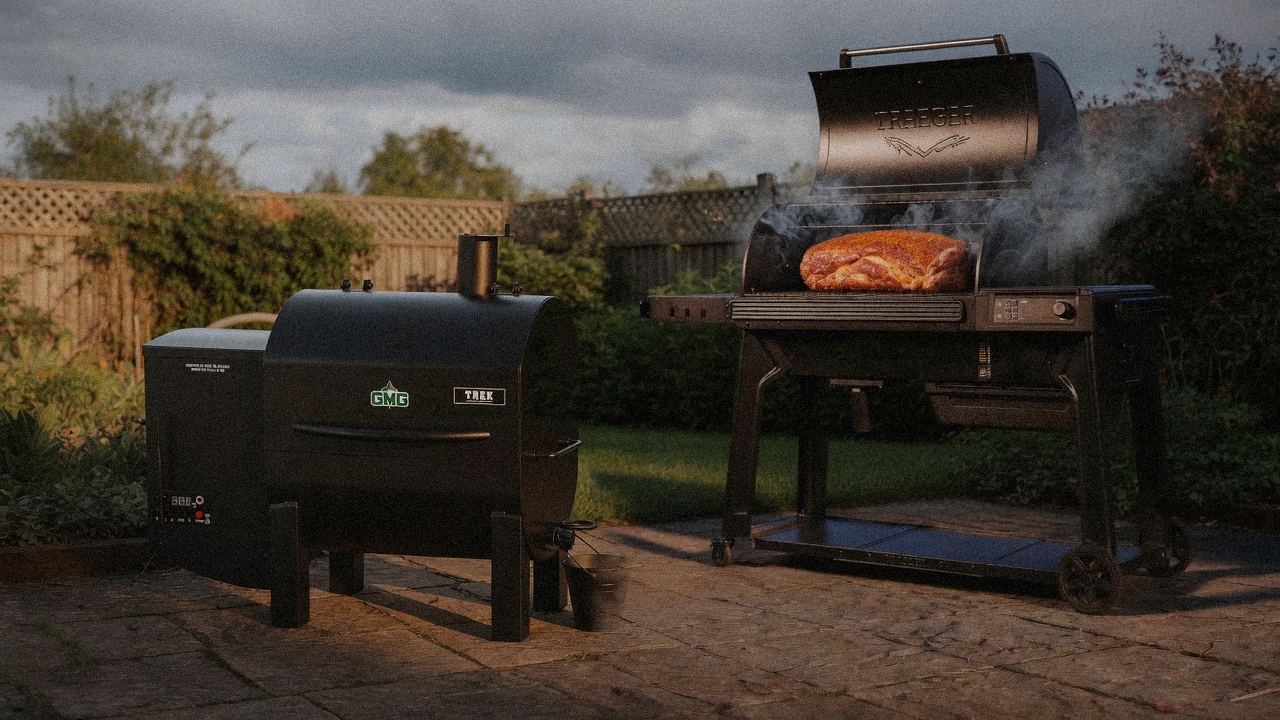 Green Mountain Grills Trek cooking next to Traeger Timberline, wood pellet grills on the same patio