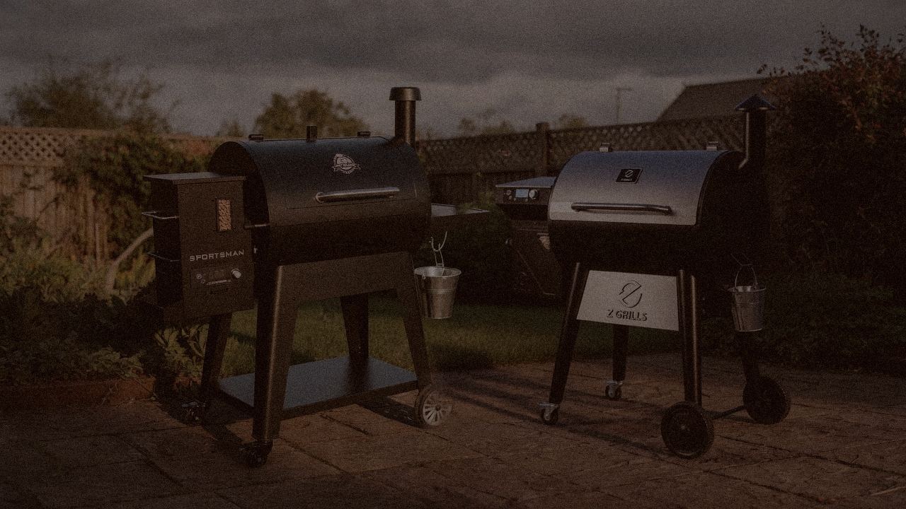 Pit Boss Navigator 850 and Z Grills 700 Series (ZPG-7002) at night with smoke, wood pellet grills on a dark patio