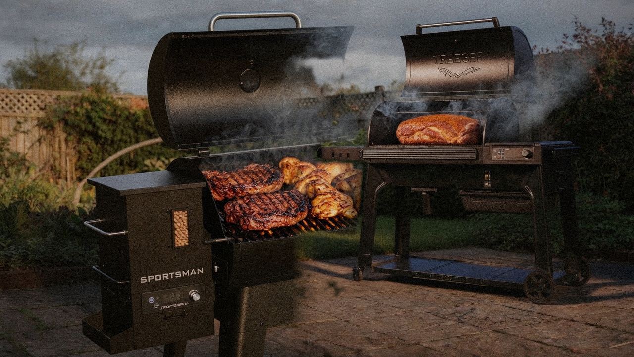 Pit Boss Sportsman cooking next to Traeger Woodridge Pro, wood pellet grills on the same patio