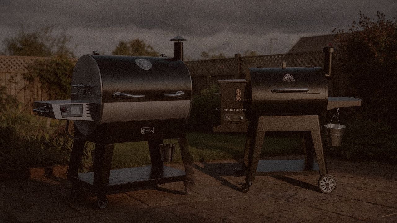 recteq Flagship 1600 and Pit Boss Sportsman at night with smoke, wood pellet grills on a dark patio