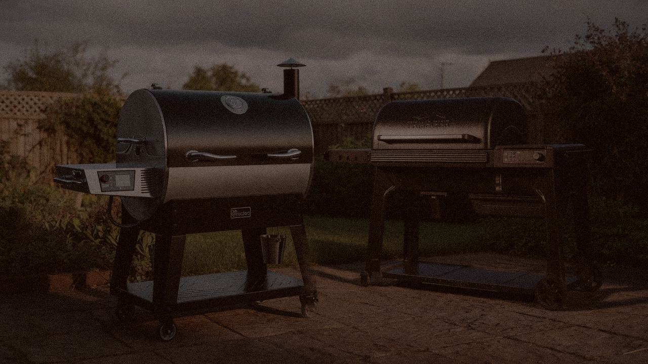 recteq Flagship 1600 and Traeger Woodridge Pro at night with smoke, wood pellet grills on a dark patio