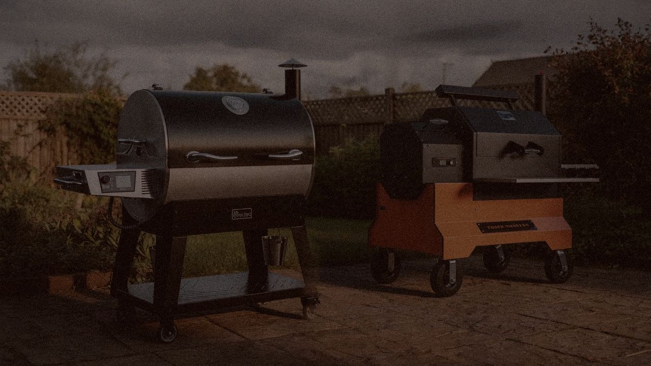 recteq Flagship 1600 and Yoder Smokers YS640s at night with smoke, wood pellet grills on a dark patio