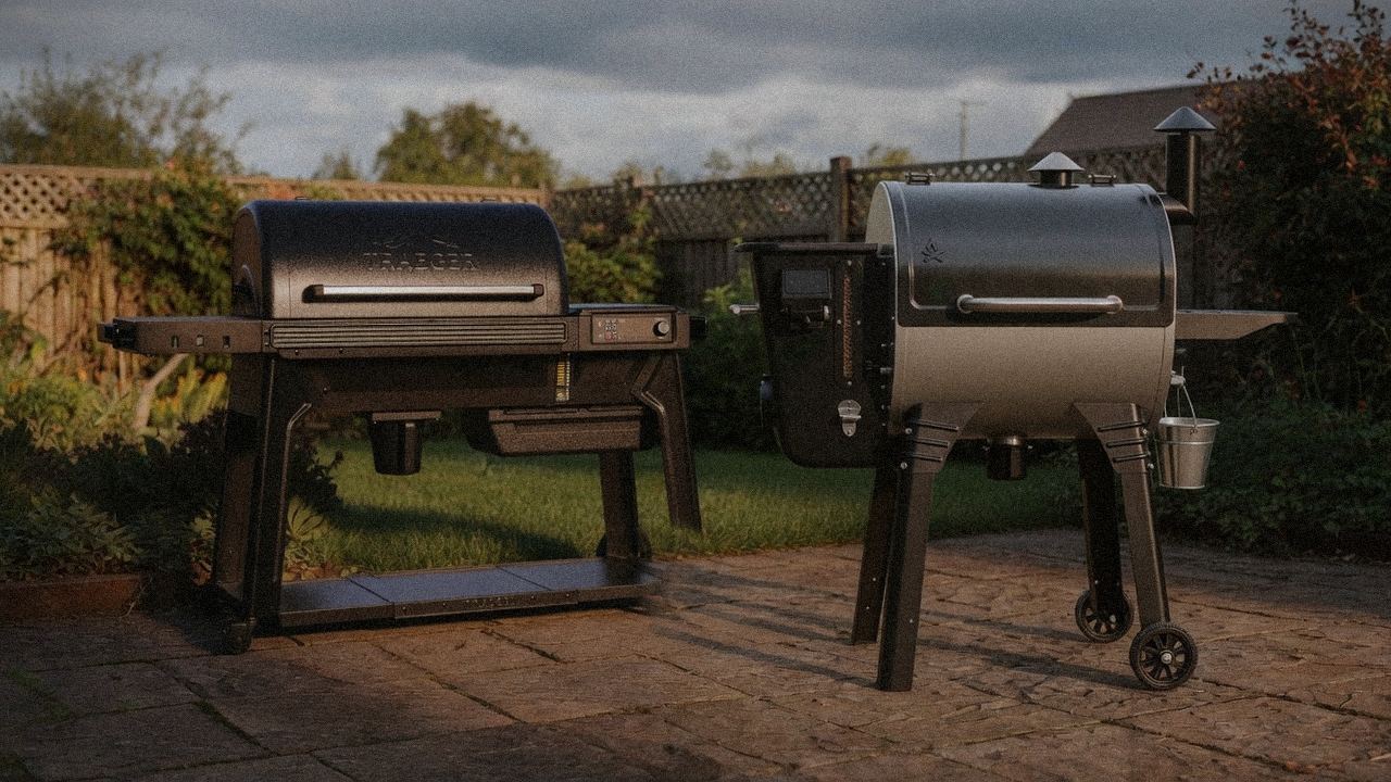 Traeger Woodridge Pro beside Camp Chef Woodwind Pro, official product photography on a dark steel panel