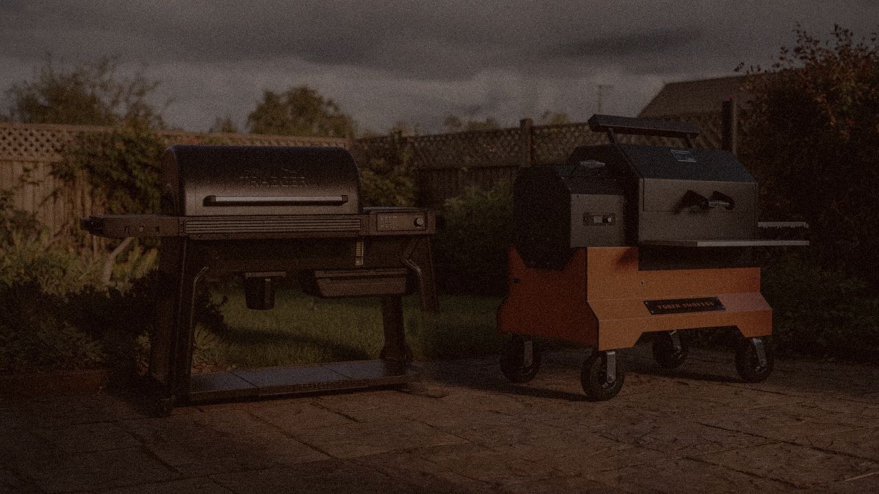 Traeger Woodridge Pro versus Yoder YS640s on a dusk patio