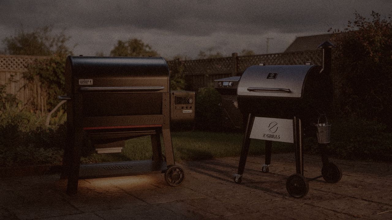 Weber Searwood XL 600 and Z Grills 700 Series (ZPG-7002) at night with smoke, wood pellet grills on a dark patio