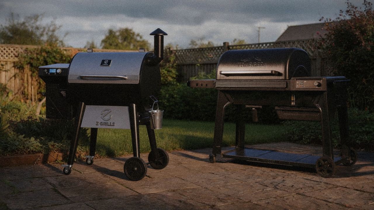 Z Grills 700 Series beside Traeger Woodridge Pro, official product photography on a dark steel panel